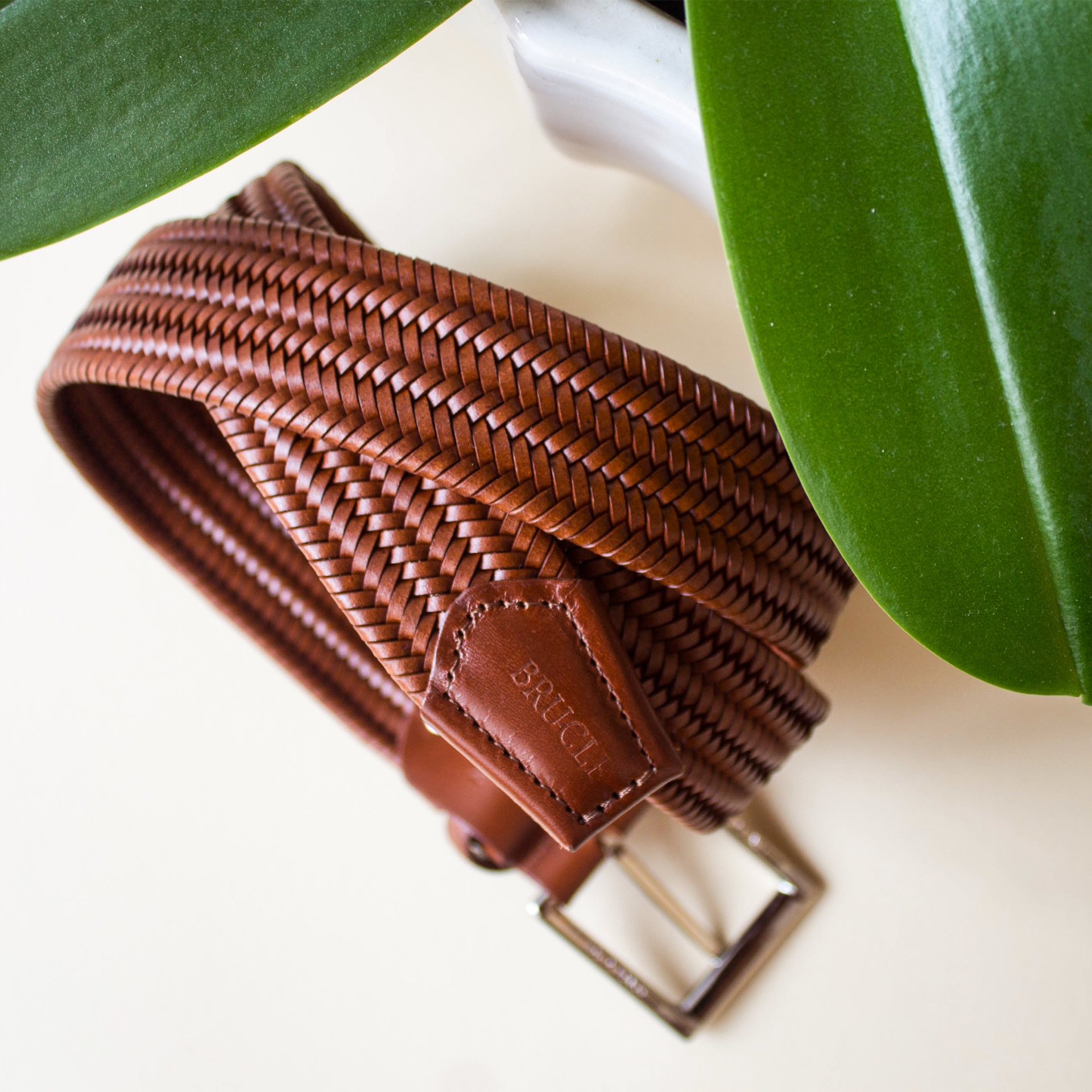 Customizable cognac woven belt in regenerated leather