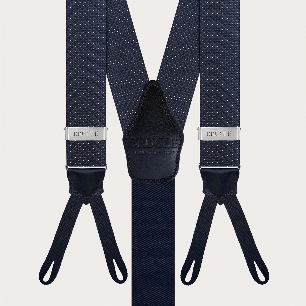 Coordinated set of button suspenders and navy blue silk pin dot bow tie