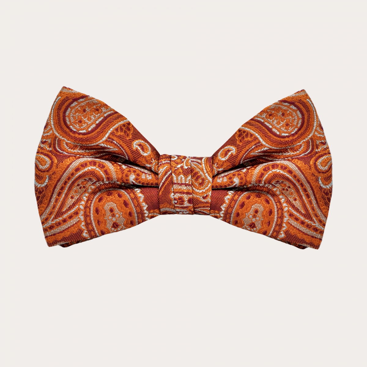 Button suspenders and coordinated bow tie in orange paisley silk